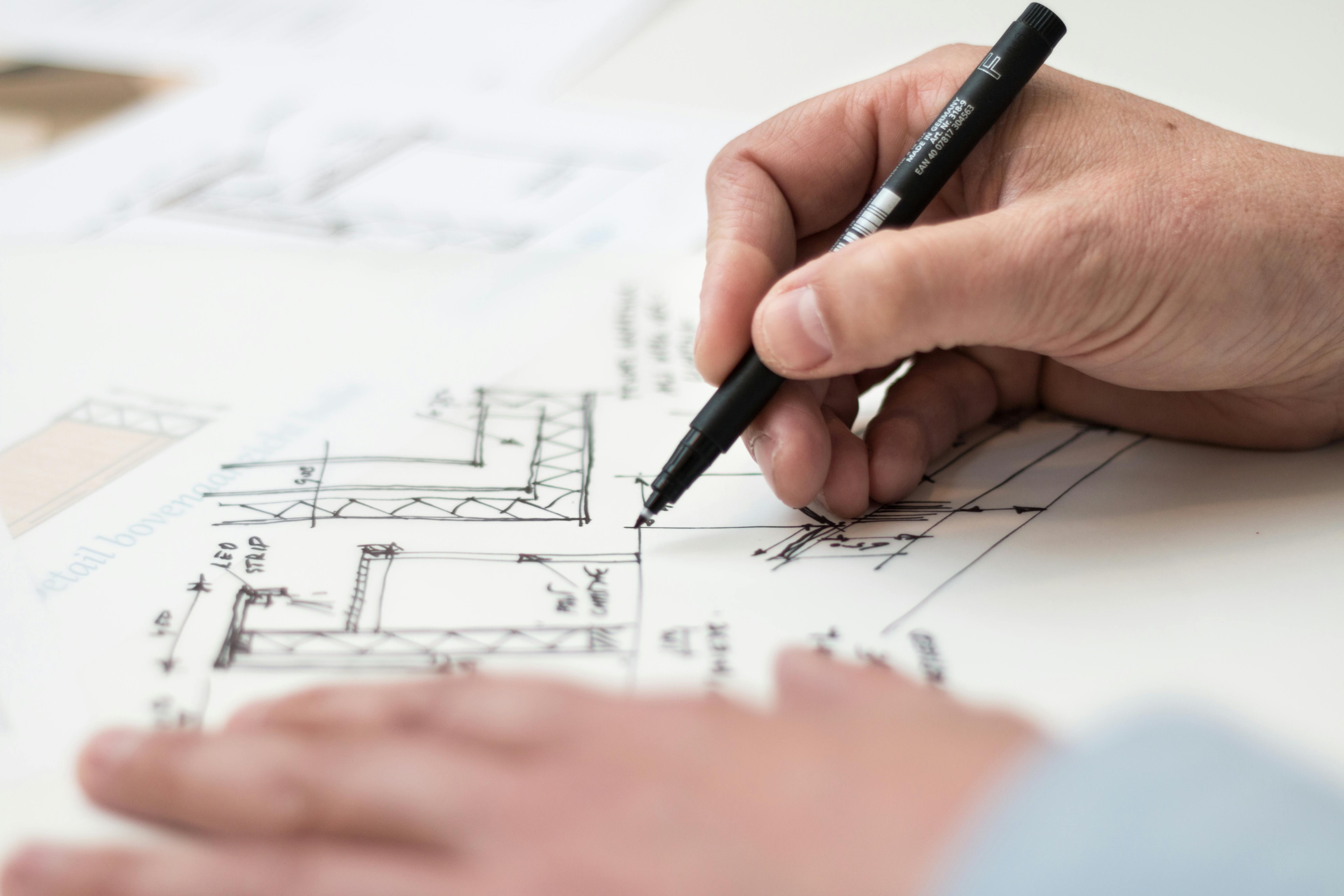 Designer sketching a yacht hull line
